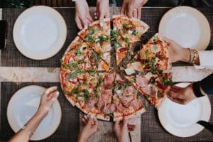 How do you attract customers to your pizza shop?